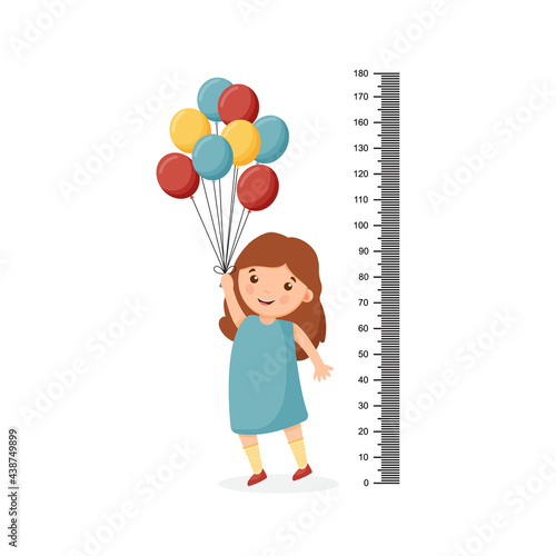 Cartoon cute girl measuring her height with a large ruler and standing on tiptoe and holding balloons