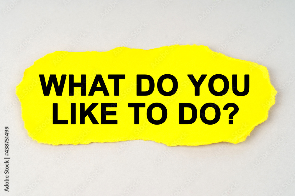 On a white background lies yellow paper with the inscription - WHAT DO YOU LIKE TO DO On a white background lies yellow paper with the inscription - WHAT DO YOU LIKE TO DO