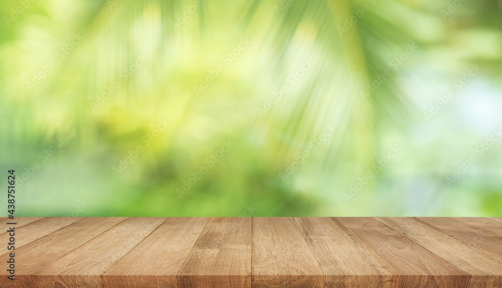 Summer and nature product display with wood table counter on blur coconut leaf background.fresh green tropical garden. Summer and nature product display with wood table counter on blur coconut leaf background.fresh green tropical garden.
