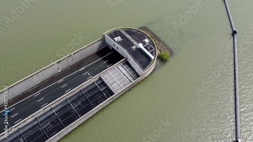 Aerial view of highway tunnel going underwater showing traffic moving in both ways located in The Netherlands which is well known for its innovative water management and infrastructure solutions 4k photo