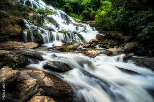 Beautiful waterfall in green forest in jungle at Ching Mai Thailand