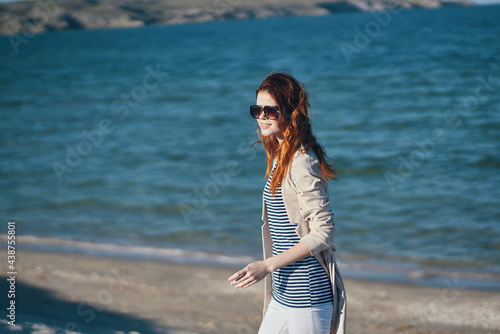 woman travels by the sea in the mountains to nature