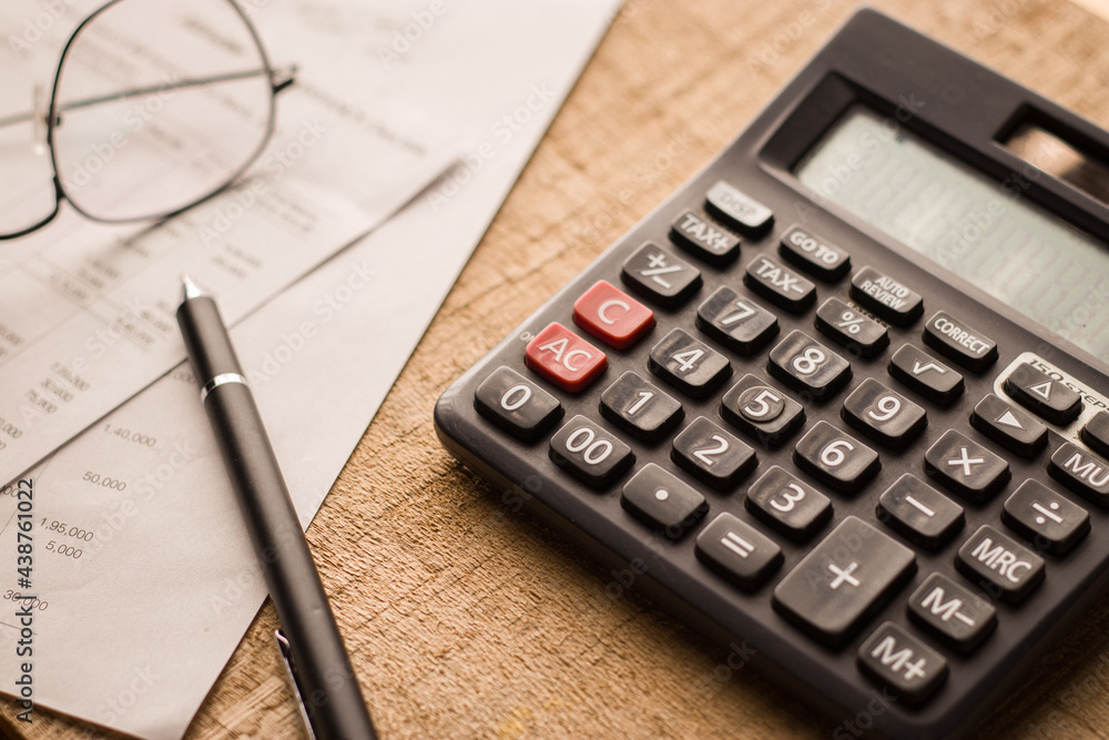 Black calculator on texture background stock image.