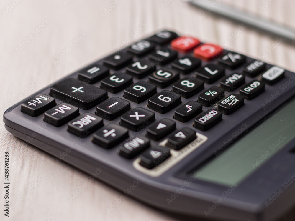 Black calculator on texture background stock image. Black calculator on texture background stock image.