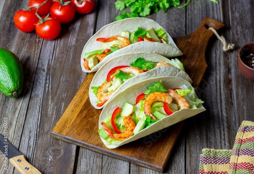 Tacos with shrimp, avocado and salad. Mexican food.