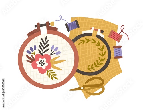 Embroidery hoops, spools of threads and scissors. Handmade needlework on canvas in frame rings. Needlecraft art. Flat vector illustration of hand-made handicraft isolated on white background