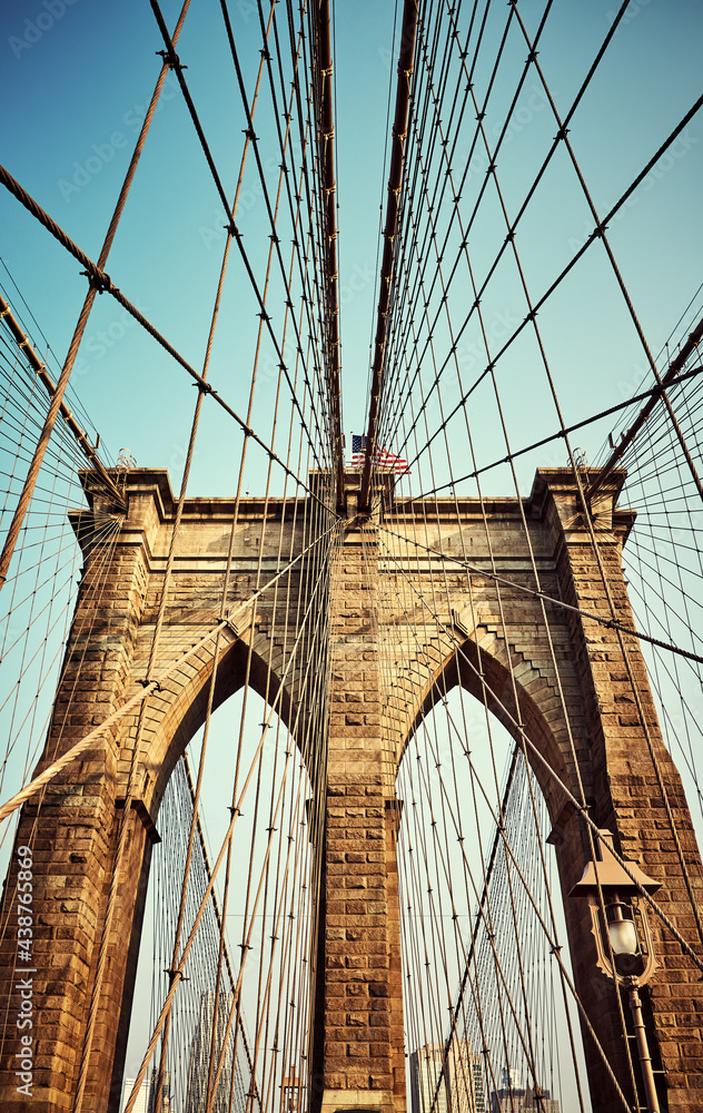 Fototapeta premium Brooklyn Bridge, color toned picture, New York City, USA.