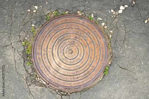 manhole cover in the street photo