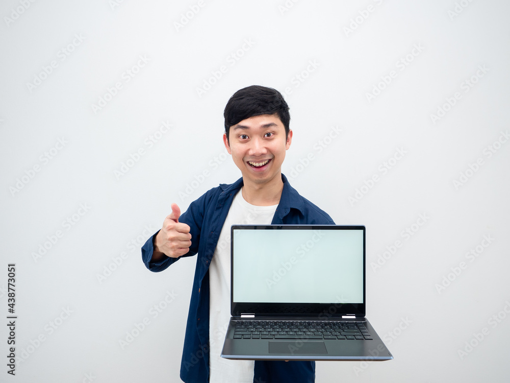 Asian cheerful man show laptop white screen in hand and thumb up looking at camera on white isolated background Asian cheerful man show laptop white screen in hand and thumb up looking at camera on white isolated background