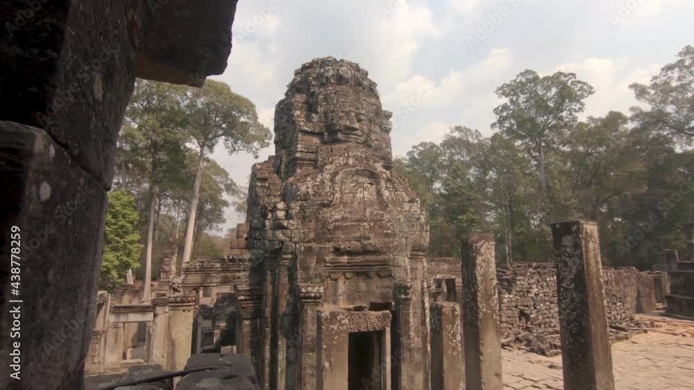 Reveal of carved face and walls, Angkor Wat stone temple, Cambodia Reveal of carved face and walls, Angkor Wat stone temple, Cambodia