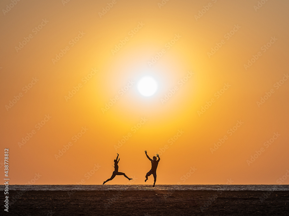 silhouette of a person jumping on the beach silhouette of a person jumping on the beach