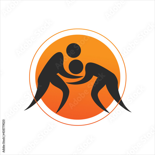 two wrestlers in a scrum, silhouettes in an orange circle