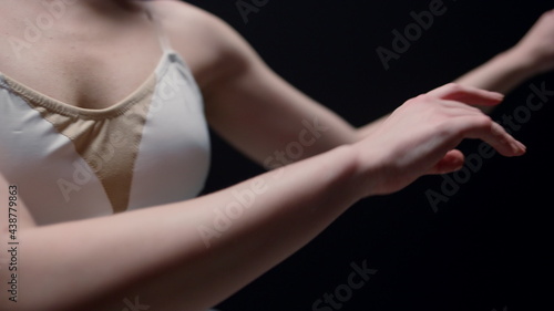 Ballerina arms doing smooth movements. Ballet dancer hands moving in air. 