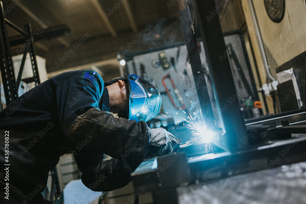 Manual worker welder on his job. People at heavy industry work. Manual worker welder on his job. People at heavy industry work.