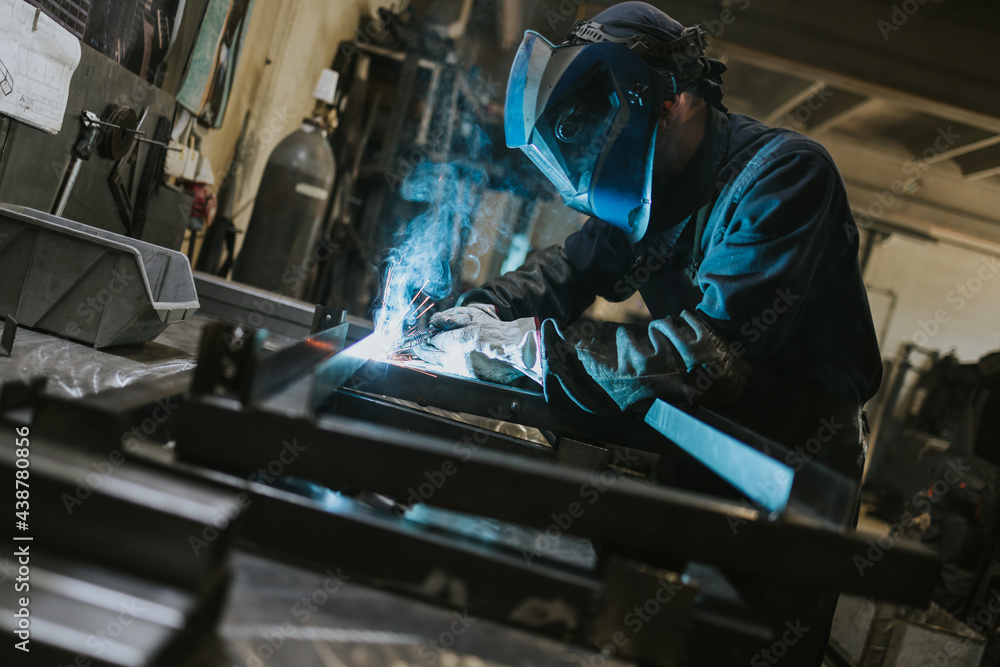 Manual worker welder on his job. People at heavy industry work. Manual worker welder on his job. People at heavy industry work.