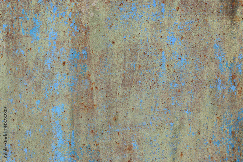 Background in the form of a rusty metal surface with peeling blue paint
