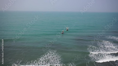 Aerial view of traditional fishing boats along the shoreline on the beach on St. Martin's Island, Teknaf, Chittagong, Bangladesh. photo