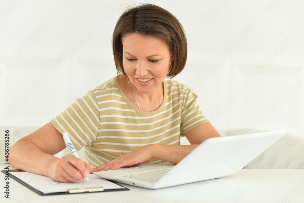 Porait of young woman with laptop in the office Porait of young woman with laptop in the office