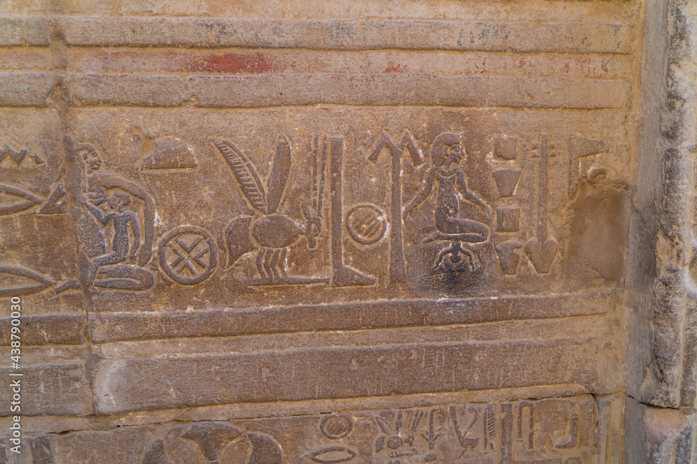 Egyptian hieroglyphs and engravings on the walls of Kom Ombo Temple on the Nile river in Egypt including Cleopatra giving birth