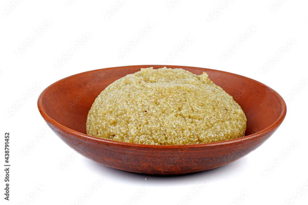 Cooked white quinoa in clay bowl isolated on a white background Cooked white quinoa in clay bowl isolated on a white background