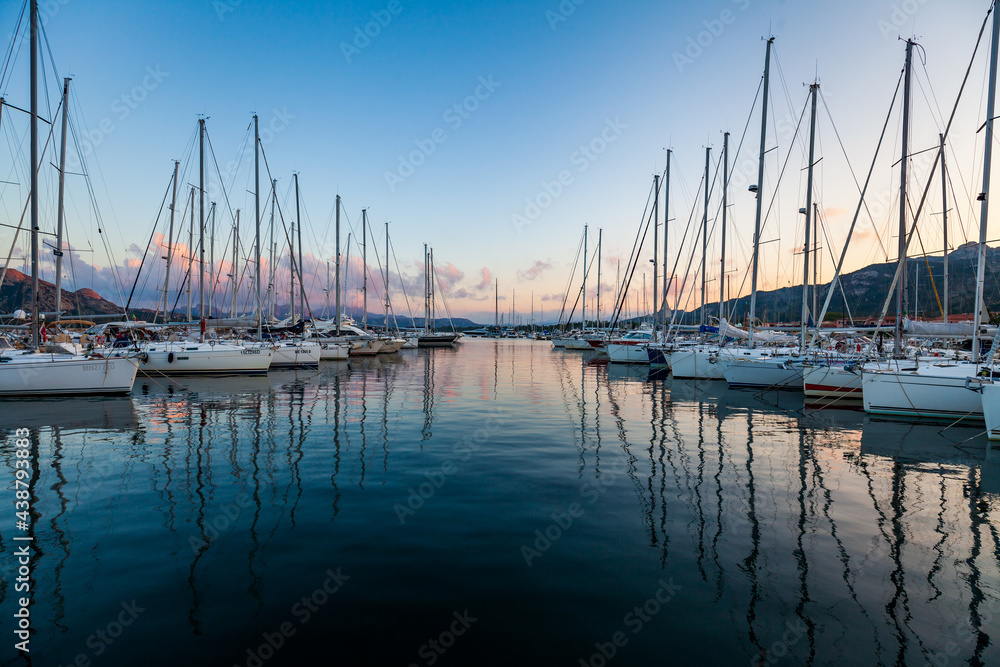 Marina yacht club on the European island of Sardinia at sunset