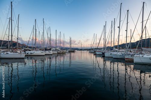 Marina yacht club on the European island of Sardinia at sunset © Ilya