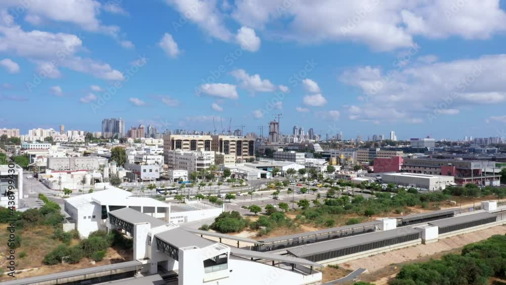Aerial view of the city of Netanya over the industrial area, overlooking the city skyline.

