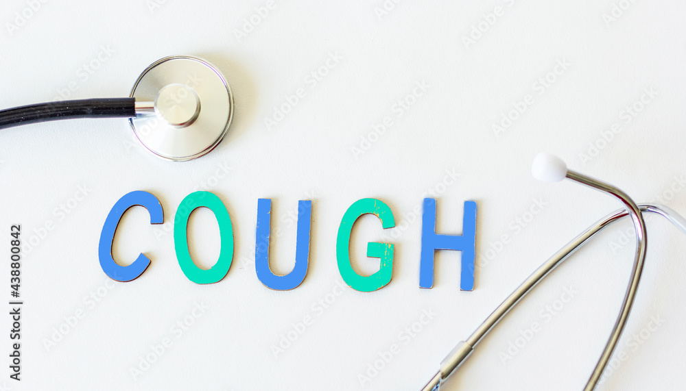 The word cough in wooden letters and with a stethoscope next to it on a white background. Conceptual for healthcare, hospitals, clinics and medical business. The word cough in wooden letters and with a stethoscope next to it on a white background. Conceptual for healthcare, hospitals, clinics and medical business.