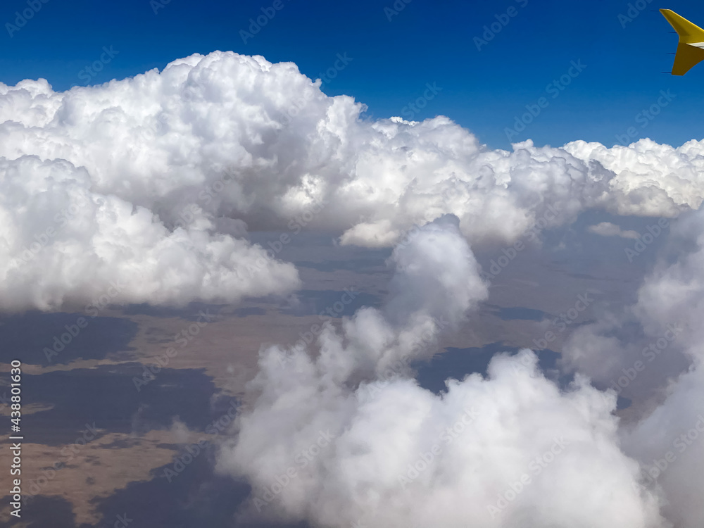 sky, clouds, cloud, blue, nature, view, aerial, white, air, high, fly, heaven, landscape, flight, cloudscape, cloudy, atmosphere, weather, horizon, space, above, mountain, day, sun, earth