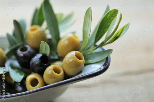  olives. Fresh organic green olives on a wooden table.Organic natural bio olives and olive oil