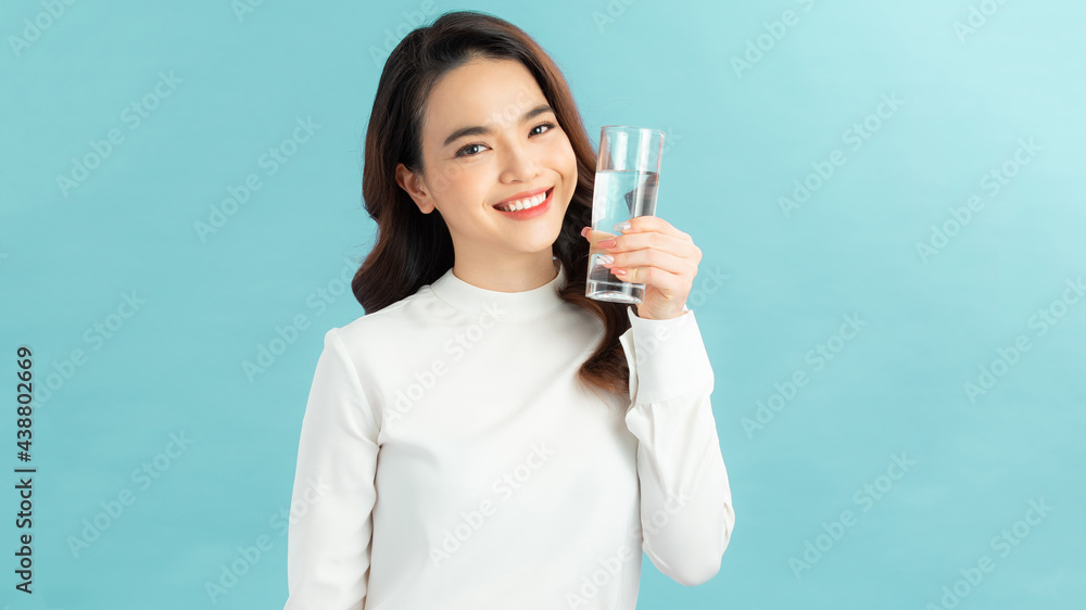 young asian woman with glass of water young asian woman with glass of water