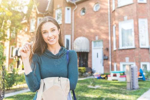 Photography Happy woman holding keys of her new house in Toronto