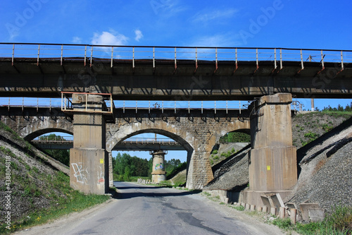 Old abandoned railway viaduct over the road
