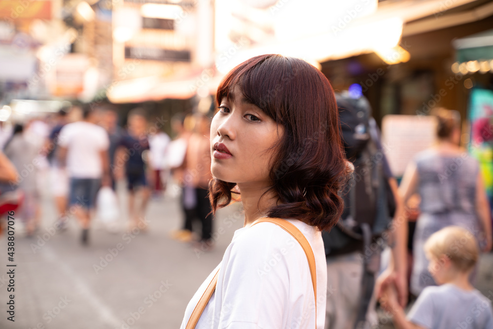 Portrait of Asian young woman on Khao San Road in Bangkok, Thailand. Portrait of Asian young woman on Khao San Road in Bangkok, Thailand.