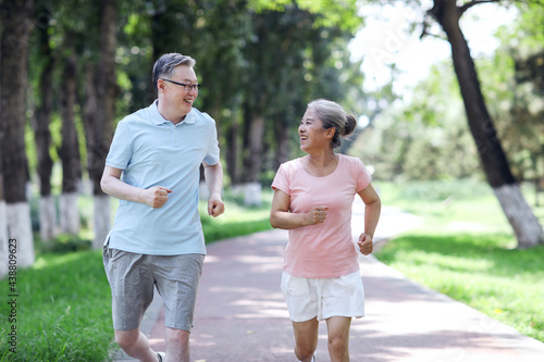 Old couple jogging in outdoor park