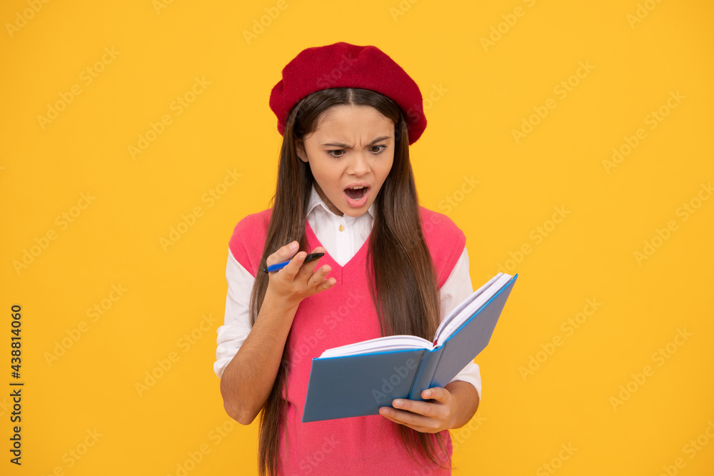 feeling shock. shocked french teen girl hold notebook. childhood happiness feeling shock. shocked french teen girl hold notebook. childhood happiness
