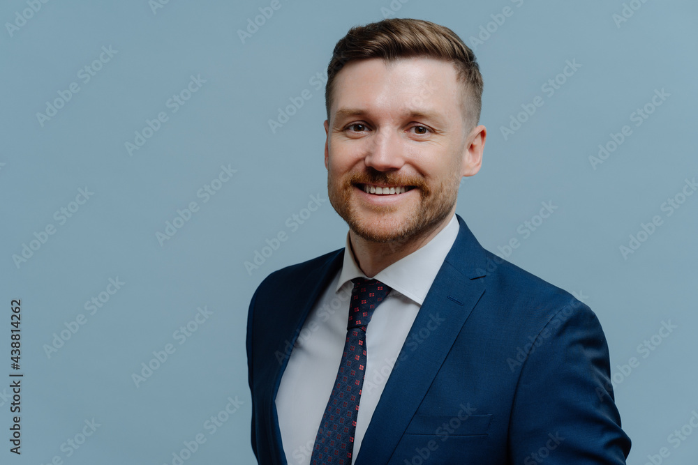 Portrait of happy handsome business man smiling at camera Portrait of happy handsome business man smiling at camera