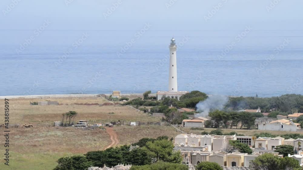 the lighthouse of San vito lo Capo in sicily photographed with a telephoto lens the lighthouse of San vito lo Capo in sicily photographed with a telephoto lens