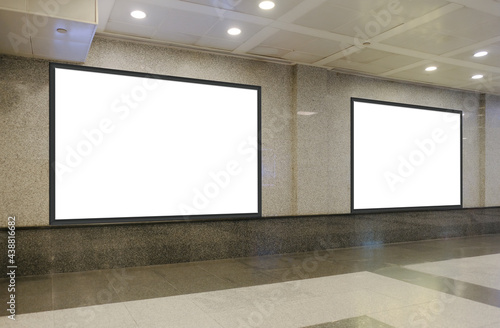 Two blank billboards of advertising spaces on textured wall for mock up purpose; OOH digital ad placement templates in shopping mall or underground train station; with perspective.