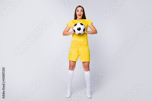 Full length body size view of her she nice-looking attractive lovely cheerful cheery glad straight-haired girl holding in hands ball pass isolated over light white gray pastel color background