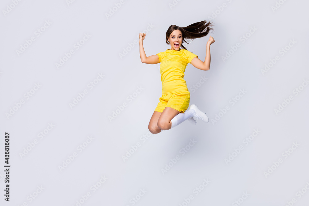 Full length body size view of nice beautiful satisfied crazy energetic glad cheerful cheery lucky straight-haired girl jumping having fun isolated over light white gray pastel color background