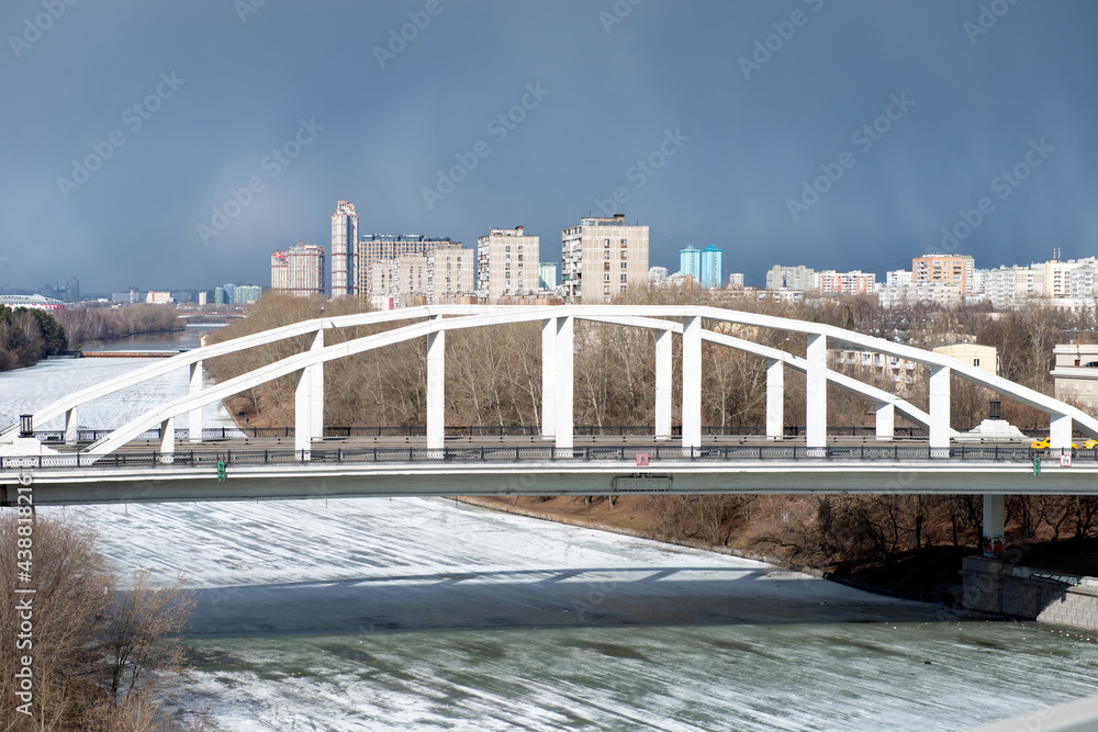 Naklejka premium View of the Khoroshevsky bridge on a spring day - a bridge across the Khoroshevskoe straightening of the Moskva River in the Serebryany Bor area. Connects Marshal Zhukov Avenue with Tamanskaya Street
