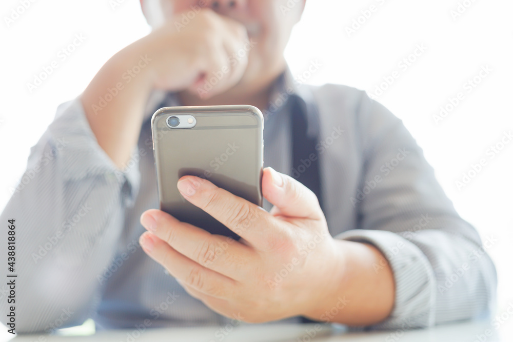 Smartphone Mobile phone hold touch in a Asian people hand in coffee shop restaurant waiting for friends with hand touching a Smart Phone, Technology smartphone communication Background Concept Smartphone Mobile phone hold touch in a Asian people hand in coffee shop restaurant waiting for friends with hand touching a Smart Phone, Technology smartphone communication Background Concept
