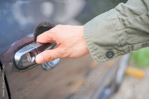 Hand on handle. Close-up of Asian man hand opening / close a car door, chauffeur car service driver sharing car pull Taxi home delivery background concept
