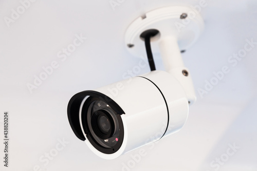 CCTV camera on the hull of an expensive motor yacht. CCTV camera white on a white body.