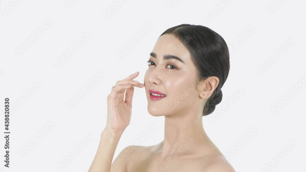 Beauty concept of 4k Resolution. A beautiful woman is gently caressing her face on a white background. Beauty concept of 4k Resolution. A beautiful woman is gently caressing her face on a white background.