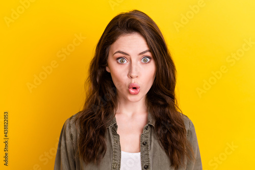Portrait of attractive amazed girl wearing casual pout lips sudden news isolated over bright yellow color background © deagreez