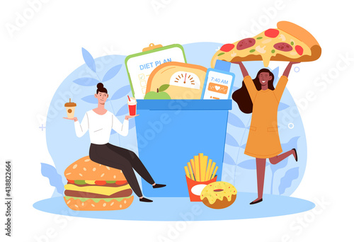 Two happy women are eating tasty junk food breaking diet together