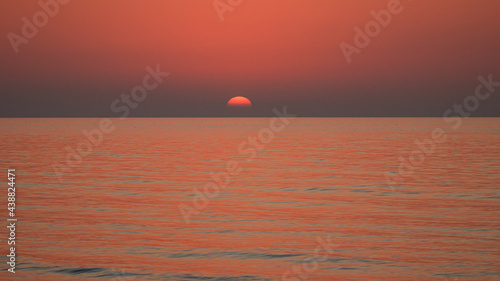 Fototapeta Naklejka Na Ścianę i Meble -  Sunrise at the sea. Calm at sea and sunset