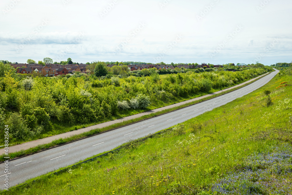 empty uk motorway road over town landscape in england